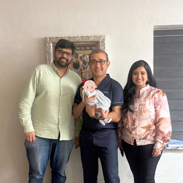 Couple sharing a parenthood success moment